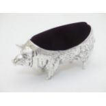 A large silver plate pin cushion formed as a pig 4 1/2" long CONDITION: Please Note