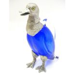 A 21stC novelty claret jug formed as a duck with blue glass body,