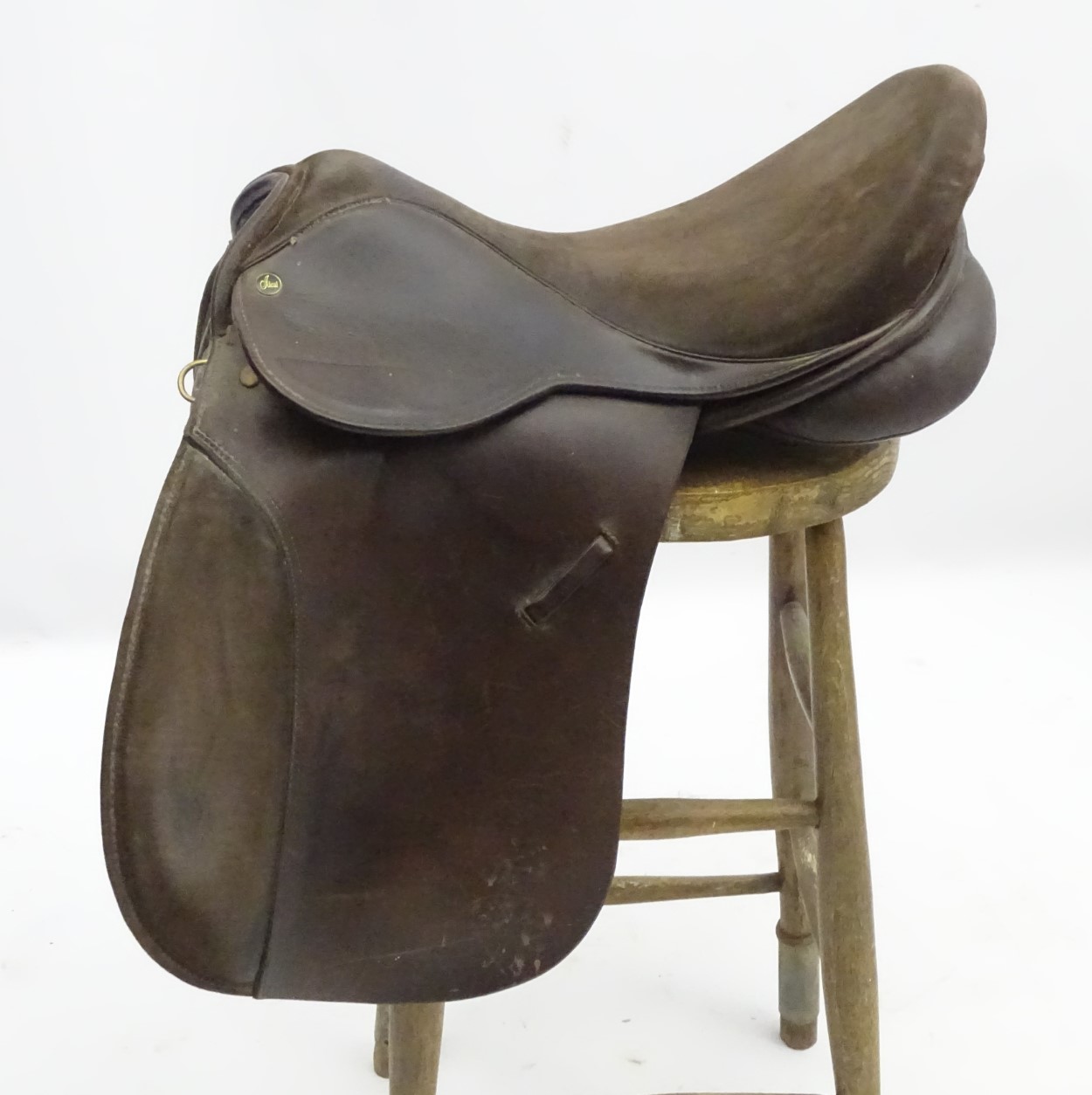 Equestrian: a brown leather English hunting saddle by the Ideal Saddle Co, Walsall,