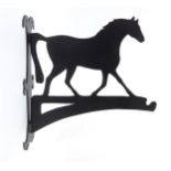 Equestrian: a flower basket hanger formed as a trotting horse, with matte black painted finish,