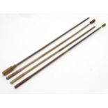 Shooting: A collection of four antique shotgun cleaning rods,