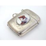 A silver plate vesta case with later applied 21stC ceramic cabochon with horse head decoration.