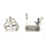 2 Continental silver miniature figure groups one formed as a lamplighter the other a Dutch figure.