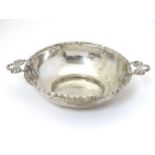 A silver bon bon dish with ribbon handles hallmarked Birmingham 1907 maker E S Barnsley & Co.