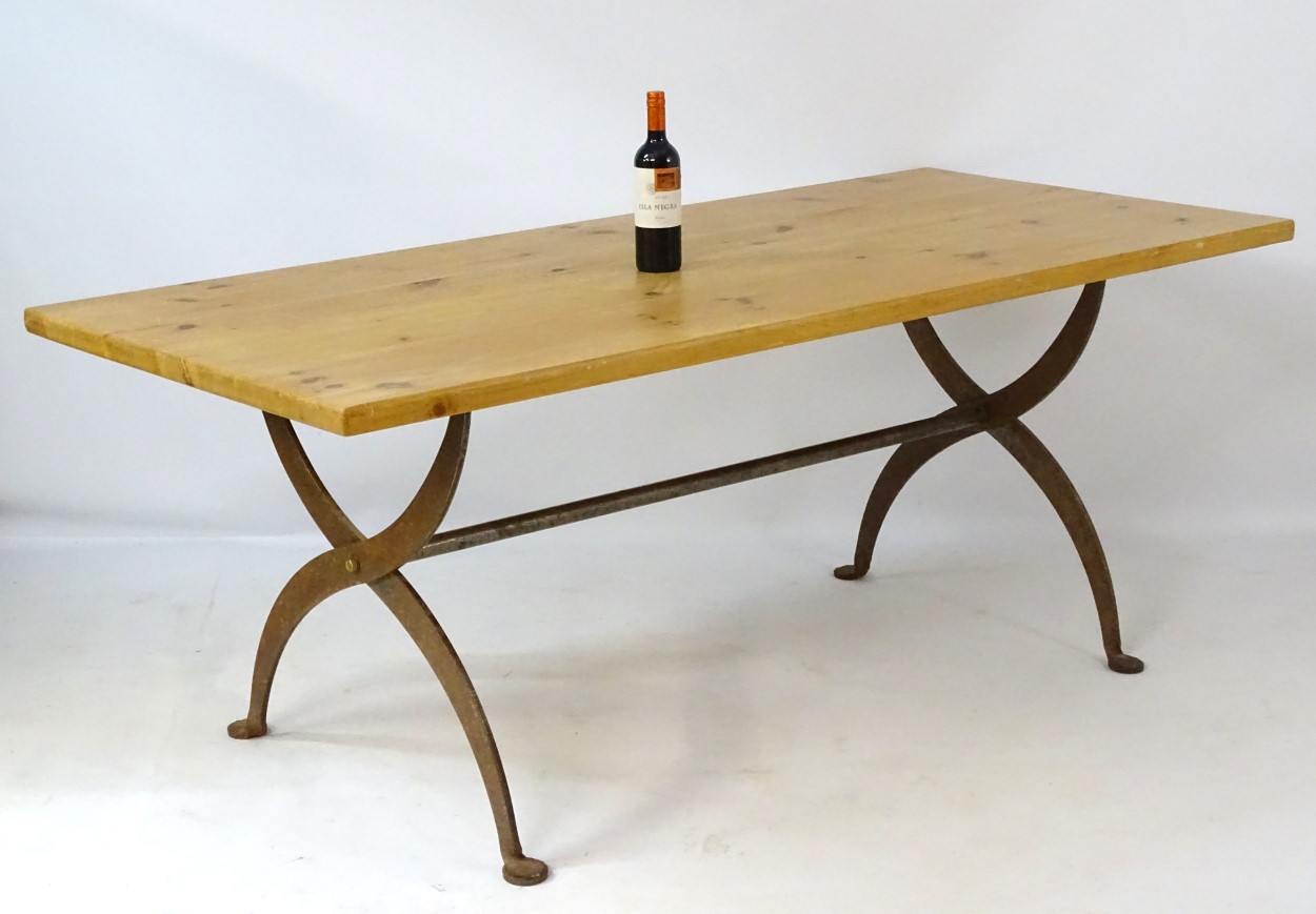 A late 20thC pine topped dining table with a wrought iron X-framed base having a central trestle - Image 3 of 5