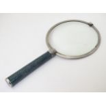 A large magnifying glass with silver surround hallmarked London 1913 maker Samuel Jacob with