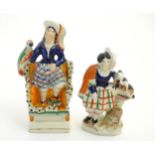 Two Victorian Staffordshire pottery flatback figures modelled as two highland women,