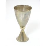 A 20thC small silver chalice of conical form. Hallmarked London 1975 maker Mappin & Webb.