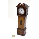 Miniature Longcase: An Edwardian inlaid mahogany cased miniature grandfather clock having a 1 3/4"