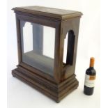Bracket clock case: A late Victorian mahogany bracket clock with shaped and glassed ears,