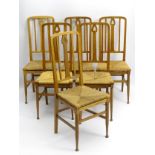 A set of six oak Arts and Crafts dining chairs with pierced back splat,