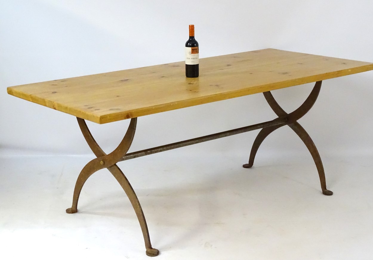 A late 20thC pine topped dining table with a wrought iron X-framed base having a central trestle - Image 4 of 5