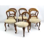 A set of six mid 19thC rosewood dining chairs with balloon backs, carved frames and mid rail,