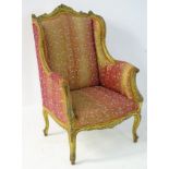 A mid 19thC giltwood armchair with carved frame,