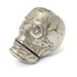 A vintage novelty silver plate vesta case formed as a human skull. 1 3/3" long.