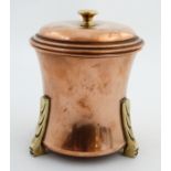 Decorative Metalware : A Linton brass and copper caddy of waisted circular form on three feet and