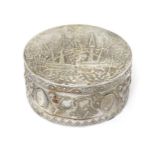 A Continental silver sugar box of circular form with hinged lid and gilded interior.