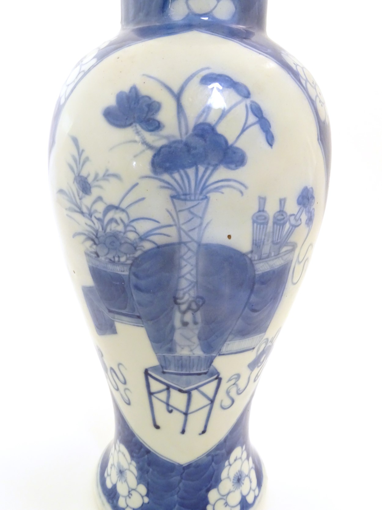 A Chinese, blue and white baluster vase decorated with prunus flowers, - Image 11 of 12