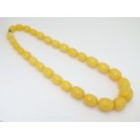 A Vintage necklace of graduated yellow Bakelite beads.