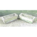 A pair of late 20thC reconstituted stone garden brick trough planters.