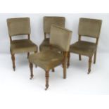 A set of four late 19thC oak dining chairs with upholstered backrest,