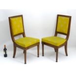 A pair of mid 19thC mahogany chairs with chamfered frames,