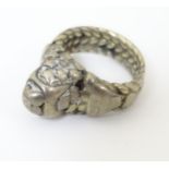 An East Asian white metal ring.