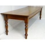 A late 19thC mahogany boardroom table / dining table standing on turned tapering legs.