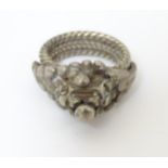 An East Asian white metal ring.