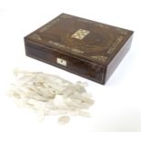 A quantity of Victorian mother of pearl gaming counters formed as fish and decorative oblong,