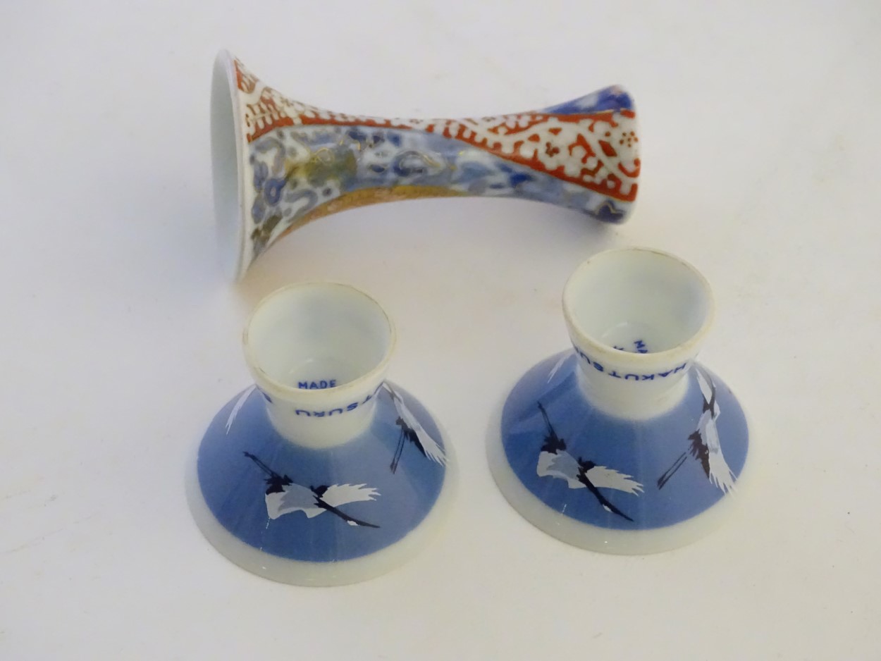 A pair of Japanese porcelain sake cups advertising Hakutsuru, decorated with flying cranes. - Image 2 of 8