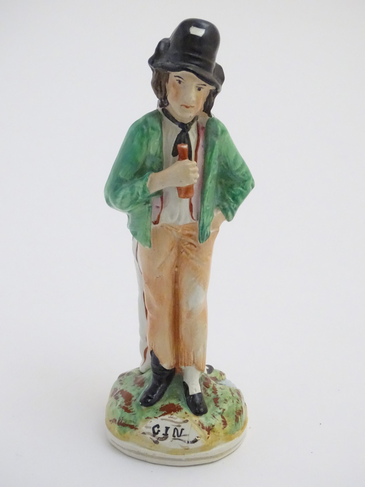 A Victorian Staffordshire pottery double-sided figure of a man standing on a circular, - Image 3 of 6