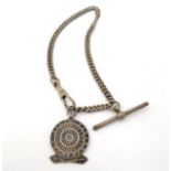 An Albert pocket watch chain and a hallmarked silver darts fob, depicting a darts board and darts,