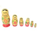 A set of Russian / Matryoshka dolls, comprising 6 graduated wooden dolls.