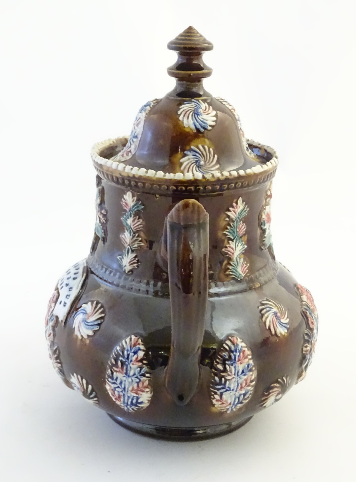 A late 19thC Measham bargeware teapot and cover with floral decoration surrounding a plaque - Image 6 of 8