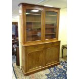 A large proportion late 19thC mahogany glazed bookcase containing shelves within,