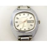 Montine (1970's): a stainless steel automatic day / date aperture gentleman's wristwatch with
