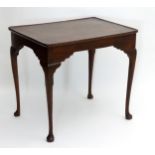 An 18thC mahogany silver table with a rectangular moulded top,