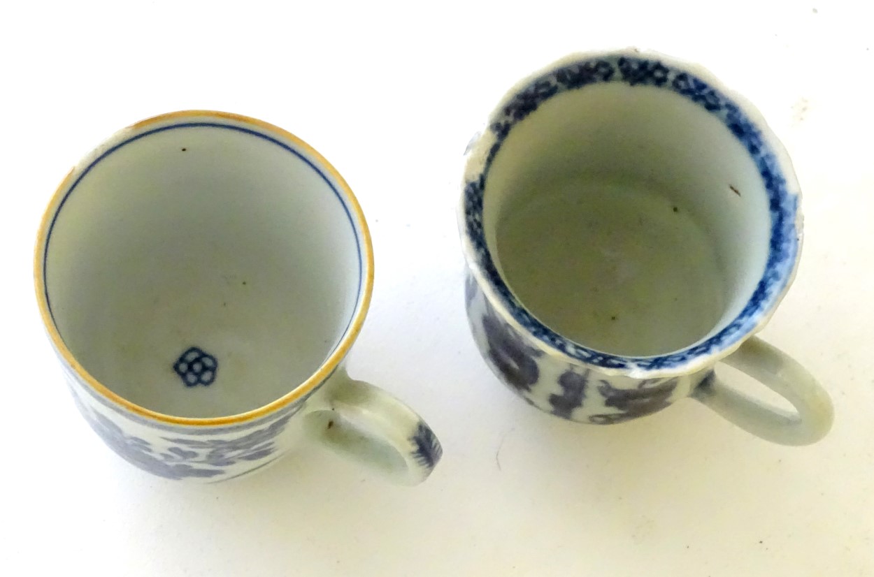 Two Chinese blue and white teacups, one decorated with flowers and foliage, the other with figures. - Image 6 of 6