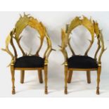 A pair of late 21stC English open armchairs,