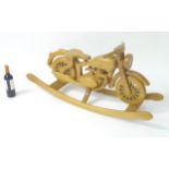 Toy: a contemporary unusual rocking horse in the form of a 1930's motorcycle (rocking motorcycle),