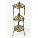 A late 19thC / early 20thC three tier brass cake stand / pot stand with pierced levels and standing
