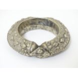 An East Asian white metal bangle bracelet of torque form . Probably Tibetan.