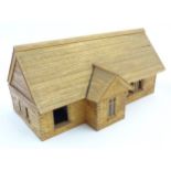 A scratch-built wooden doll's house bungalow with a removable pitched roof,