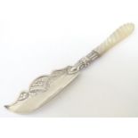 A silver butter knife with mother of pearl handle.