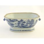 A 19thC Chinese blue and white tureen with cantered corners and twin handles formed as stylised