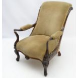 A Victorian rosewood open armchair with shaped and swept arms,