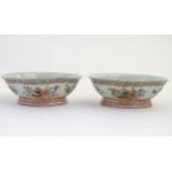 A pair of Chinese famille rose, quatrefoil shaped bowls decorated with scrolling foliage, flowers,