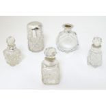 5 assorted glass scent bottles, some with silver mounts.