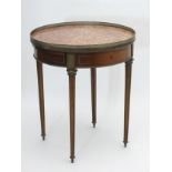 A 19thC mahogany French centre table, with marble top surmounted by a pierced brass gallery,